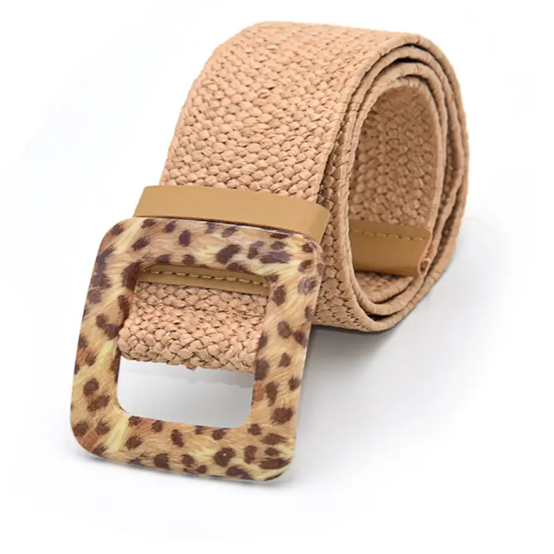 Beige woven elastic belt with a square leopard print buckle combining style and flexibility.