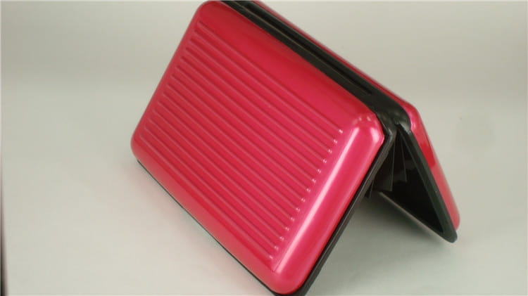 pink ribbed plastic wallet with black interior and edges featuring rfid blocking aluminum alloy ribbed card holder case design.