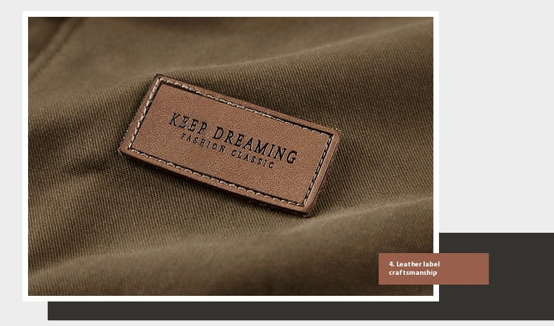 brown leather patch with stitched edges embossed with keep dreaming fashion classic on the mens fleece lined winter cotton jacket