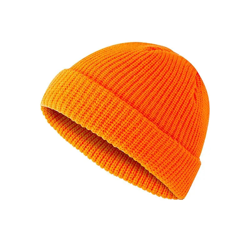 bright orange ribbed knit beanie with folded cuff shown as an alternative to the dark gray ribbed wool beanie hat product.