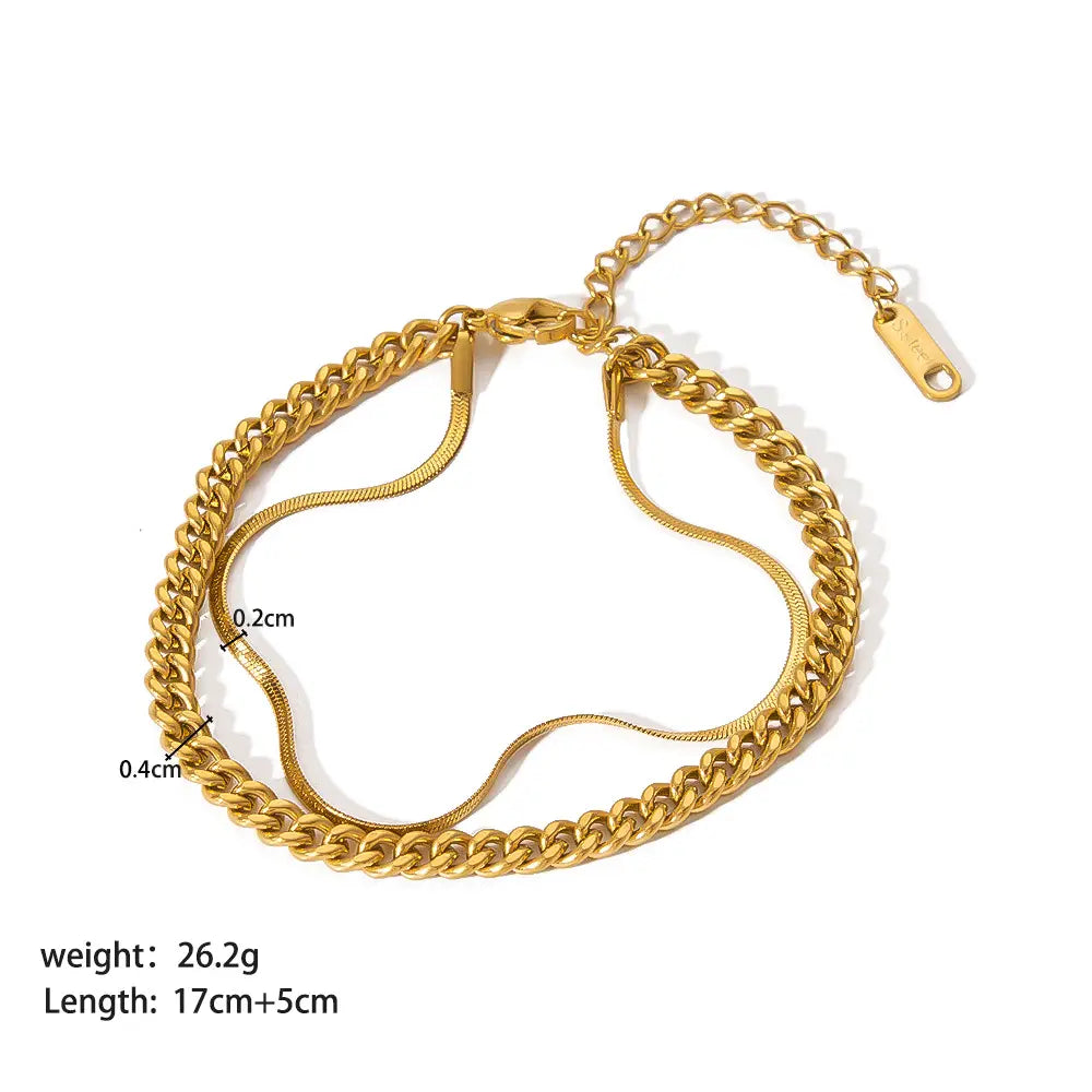 18k gold pvd plated stainless steel chain link bracelet featuring a gold-toned double-layer anklet with a thick chunky curb chain and a thinner snake chain intertwined for a layered style.