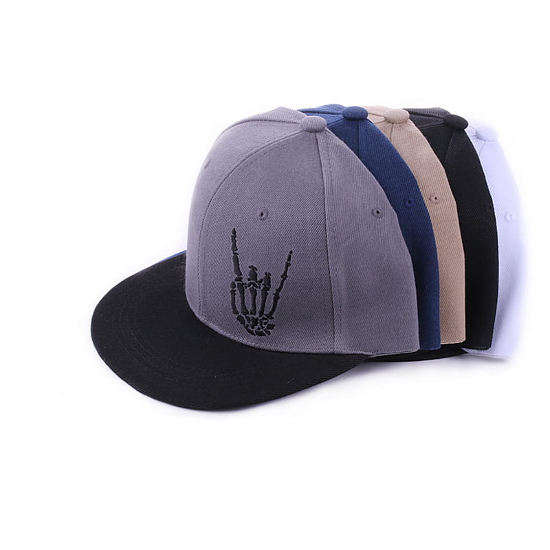 Gray snapback baseball cap with black embroidered skeleton hand gesture on the front, featuring a contrasting black brim and stitched panels.