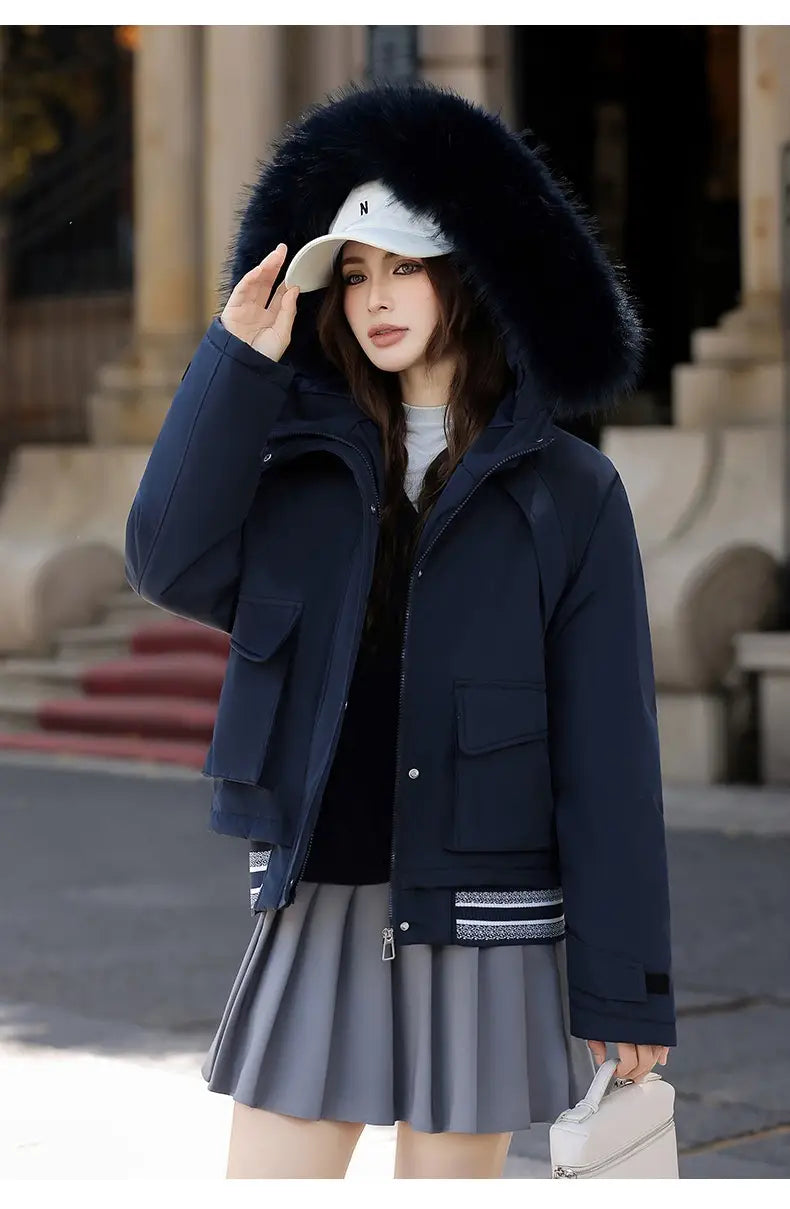 Navy blue faux fur collar puffer jacket with a plush black fur-lined hood and striped trim on the cuffs.