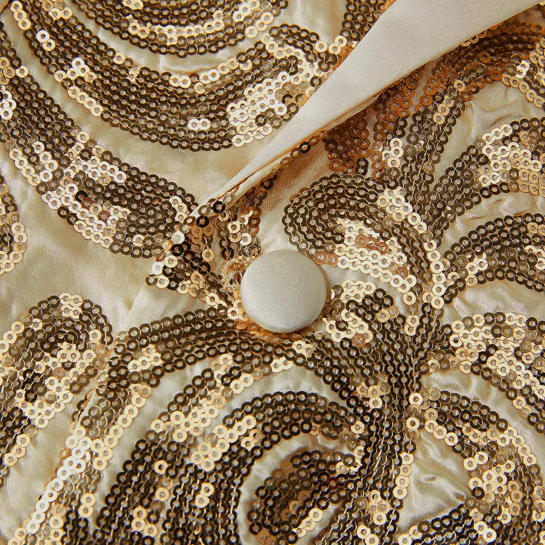 Gold sequin mens suit jacket featuring a shimmering gold and cream sequined fabric with a satin collar and a round off-white button in a retro floral blazer design.