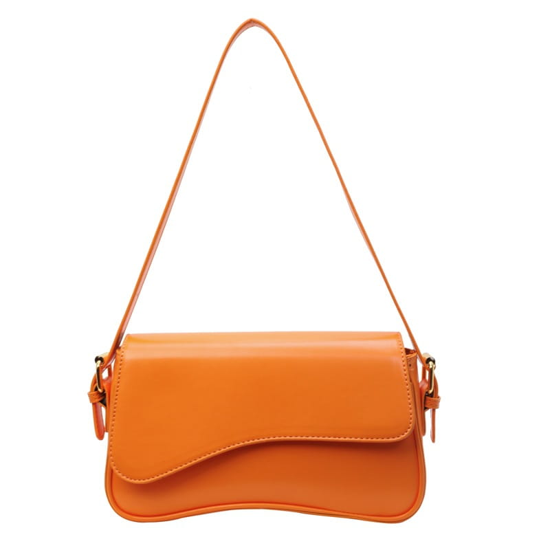 A sleek vibrant orange leather messenger bag with a smooth faux leather finish and minimalist crossbody design.