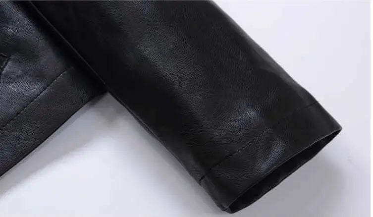 Black leather moto jacket sleeve with high collar, puff sleeves, smooth matte finish, and precise stitching.