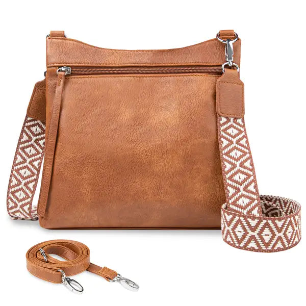 Tan faux leather multi pocket crossbody bag with an adjustable geometric patterned shoulder strap.