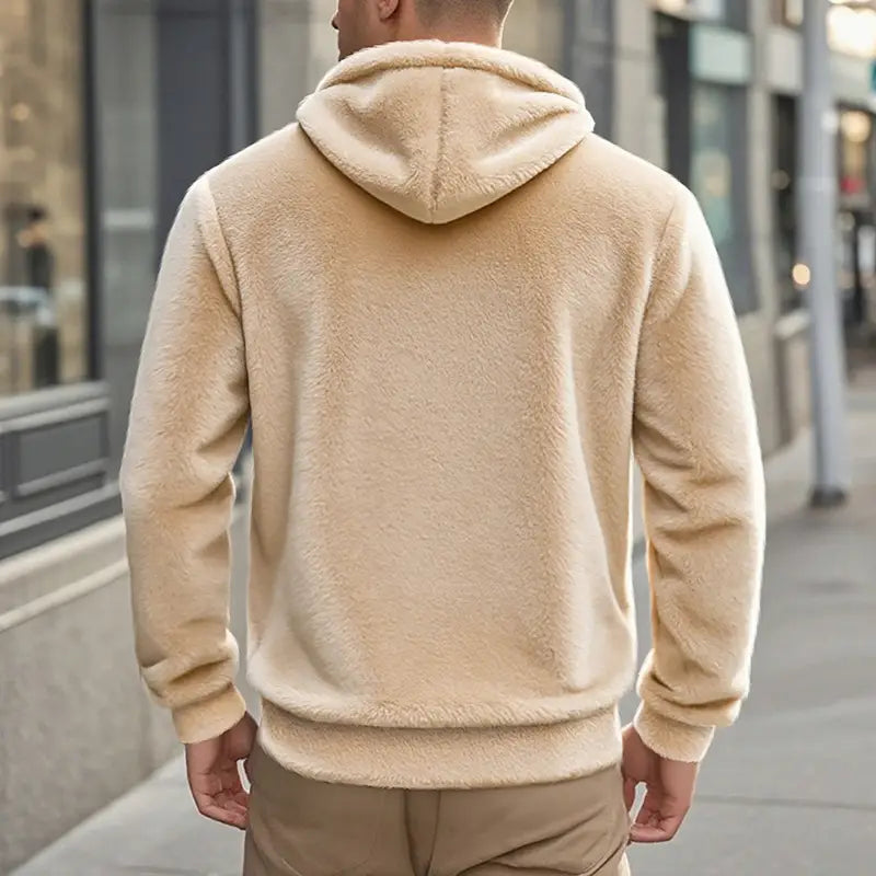 Men’s fleece lined loose zip up hooded jacket in cream color with plush fleece material, soft textured surface, and ribbed cuffs.
