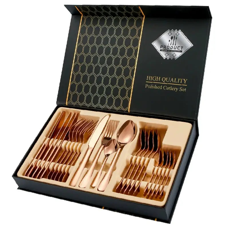 Rose gold stainless steel cutlery set 24 pieces displayed in a black gift box with honeycomb pattern interior.