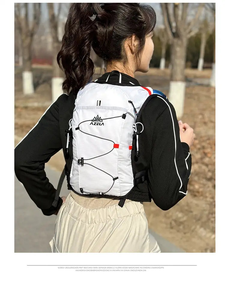white azela hydration pack lightweight running vest 20l with black straps and red accents designed for efficient hydration during outdoor activities