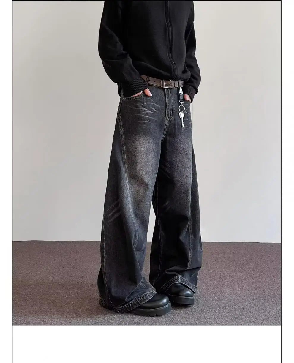 Men’s premium relaxed wide leg denim jeans in dark-wash denim with a wide-leg cut and frayed hems.