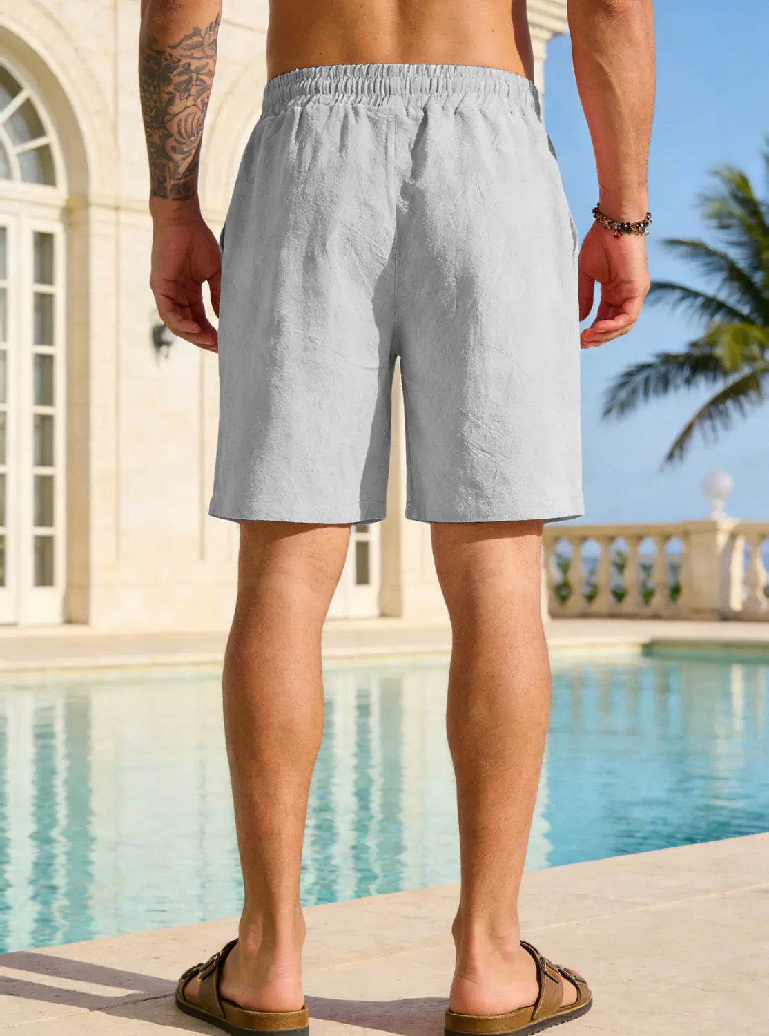 light gray relaxed-fit mens cotton linen drawstring shorts with an elastic waistband