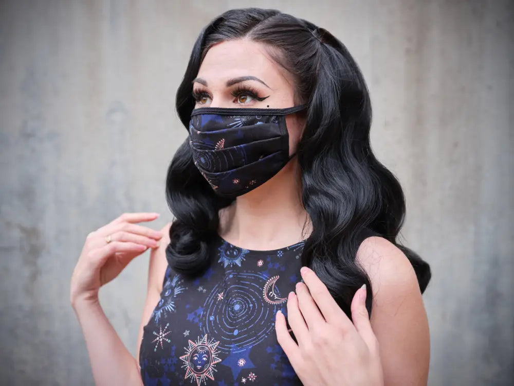 Black cotton pleated face mask with celestial pattern and adjustable elastic band for comfortable wear