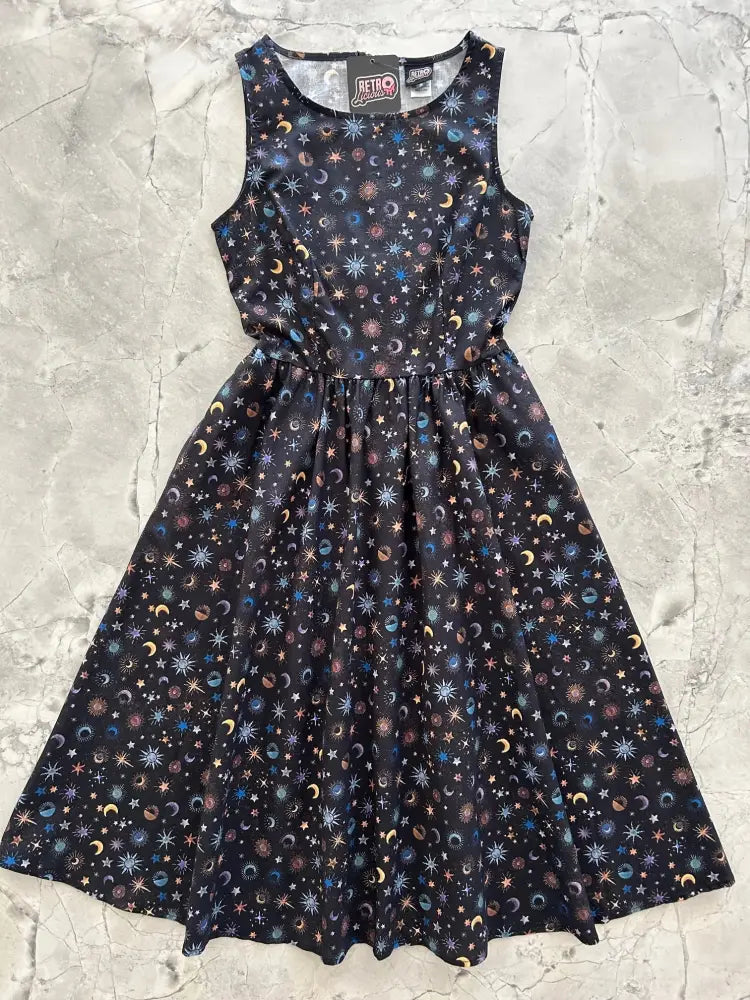 Celestial print 1950s black cotton midi dress with pockets featuring a vibrant stars moons and planets pattern