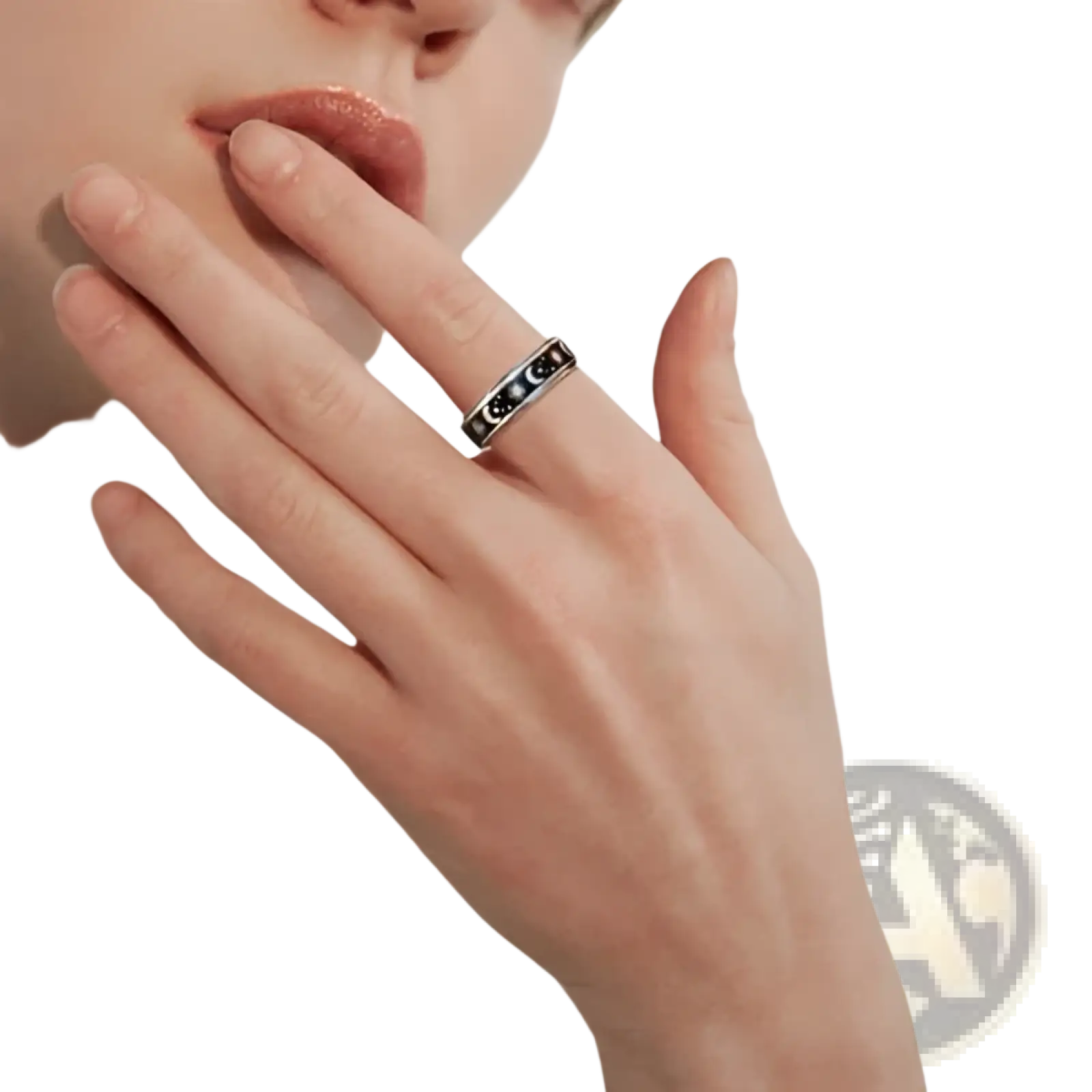 A sleek silver stainless steel anxiety spinner ring with black inlay featuring an intricate moon and star design