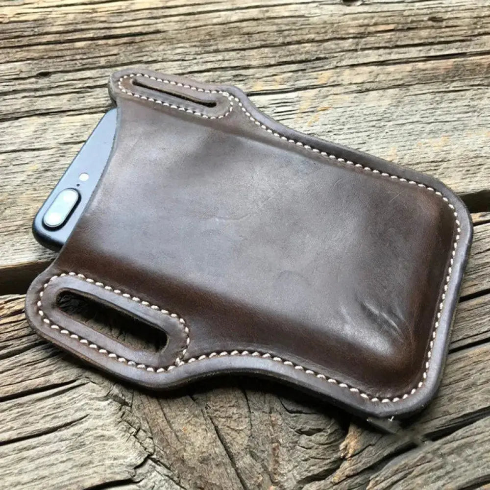 Brown pu leather phone holster with white stitching and camera cutout shown from the back side with belt loop and card slots