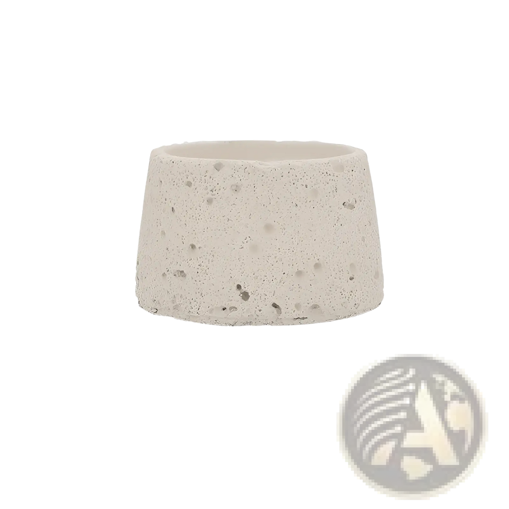 A textured light gray speckled concrete tapered cylindrical cement candle holder for aromatherapy use