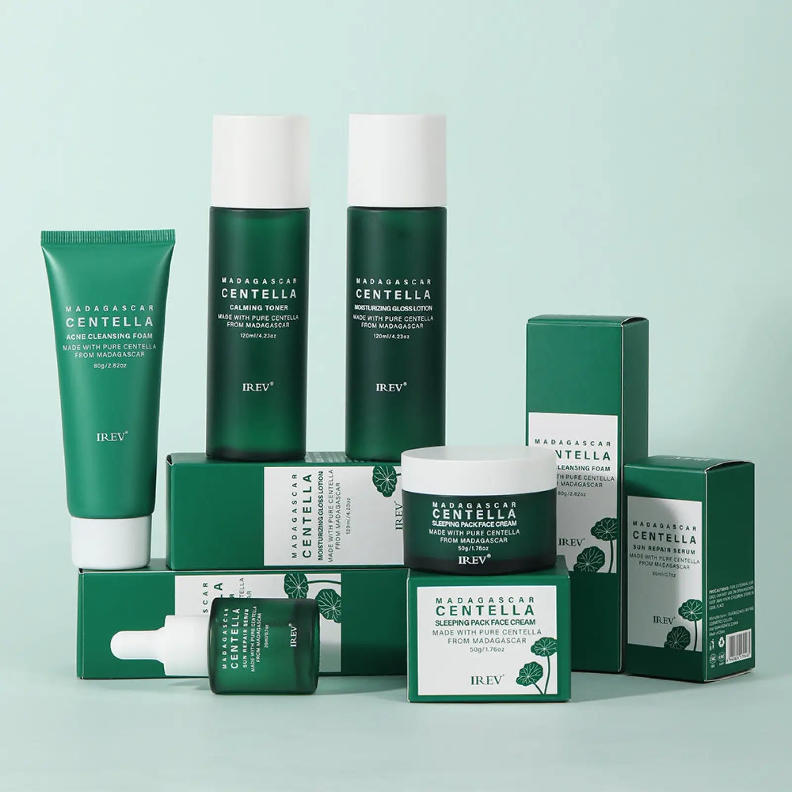 Green and white irev centella asiatica 5-piece facial skincare set with bottles tubes and boxes featuring leaf motifs