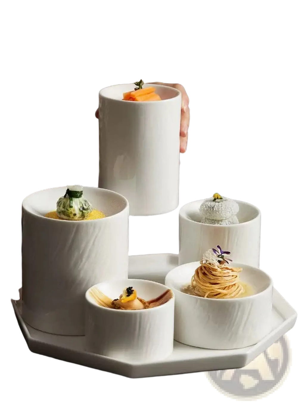 White ceramic cylindrical appetizer bowls with a matte textured finish arranged on an octagonal tray
