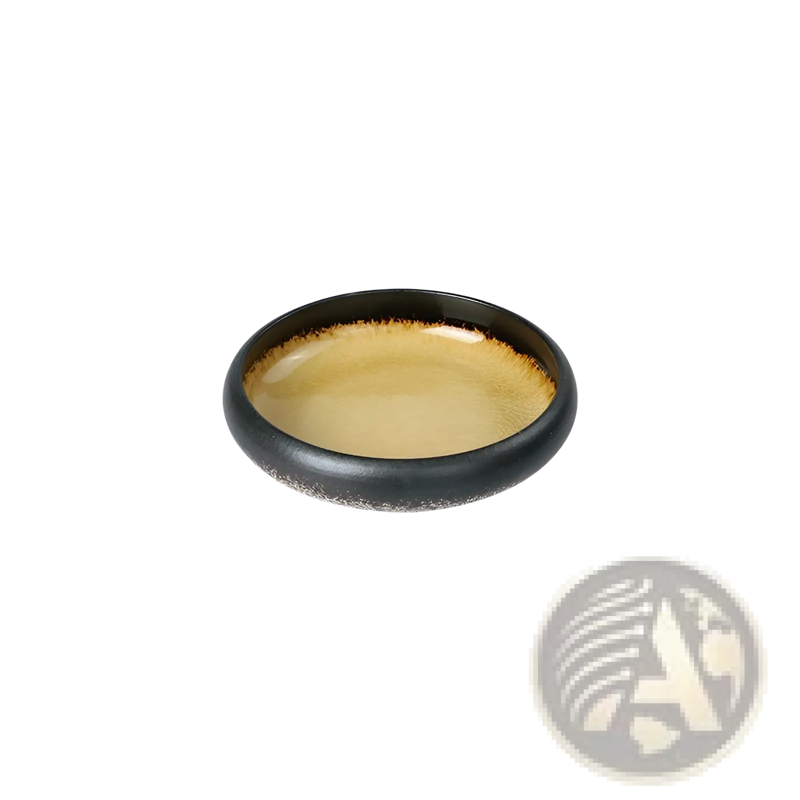 A sleek oval-shaped ceramic bowl kiln glazed with glossy black exterior and warm amber bone china interior