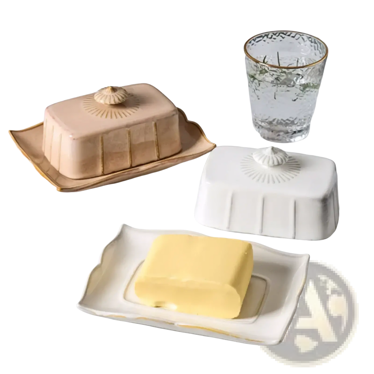 Beige ceramic butter dish with gold trim featuring a shell-shaped lid and vertical ridges on a matching tray