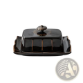 Black ceramic butter dish with glossy finish and gold-toned decorative lid for elegant kitchen use