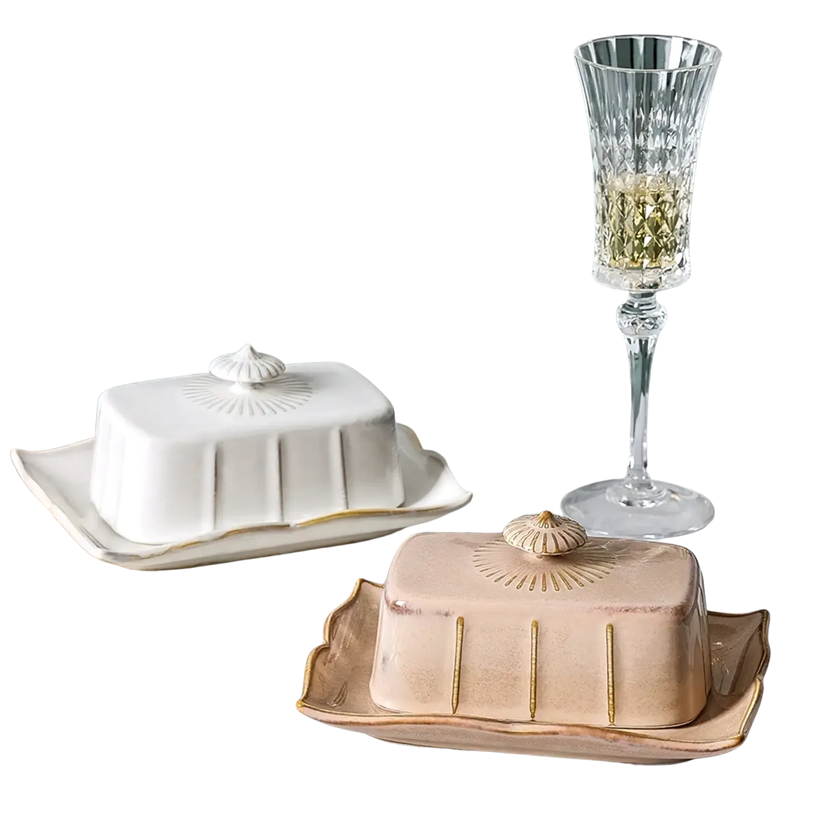 Ceramic butter dish with gold trim and shell-shaped lid in white and beige ceramic on an ornate tray
