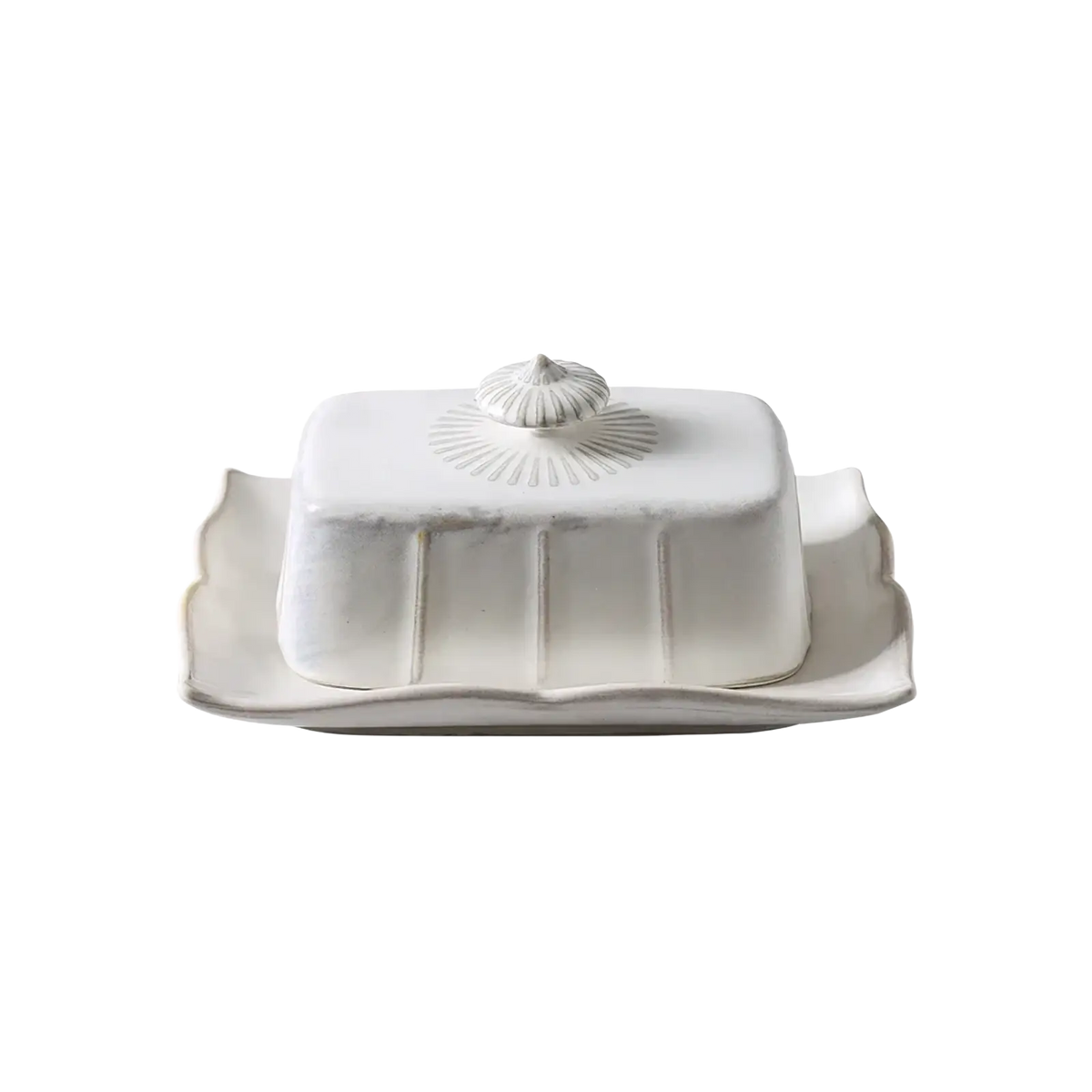Ceramic butter dish with gold trim featuring a white scalloped lid and ornate shell-like knob with sunburst pattern