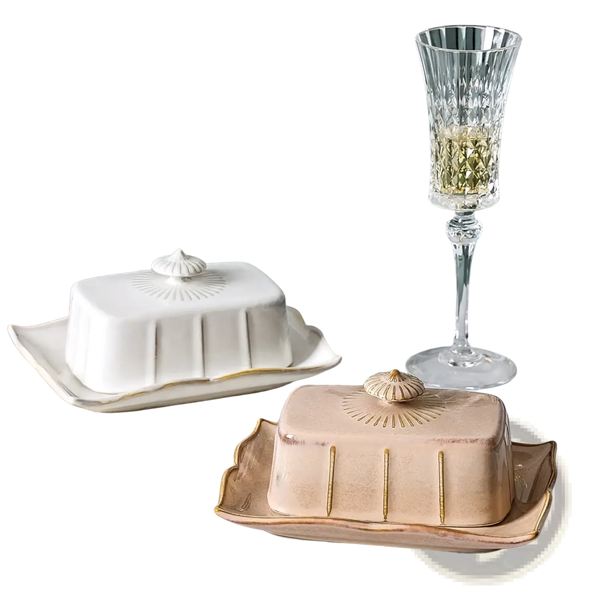 Ceramic butter dish with gold trim and shell-shaped lid in white and beige ceramic on an ornate tray