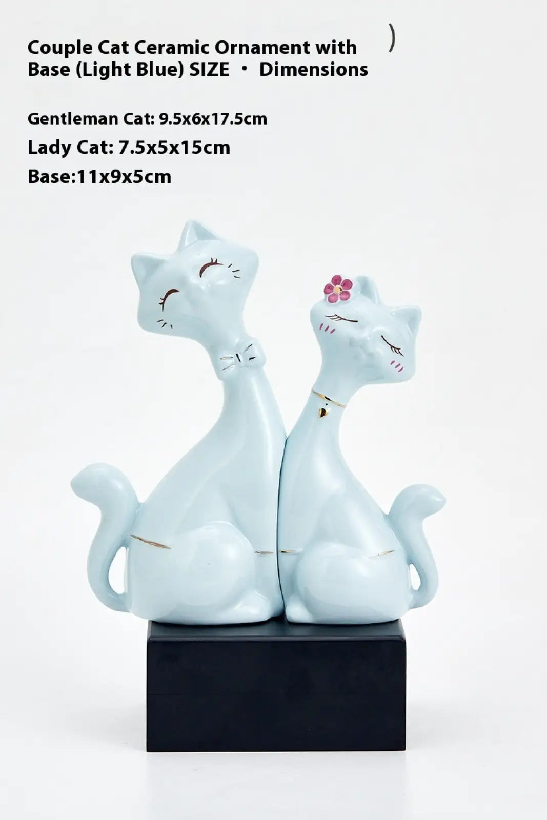 Light blue ceramic cat figurines with a gentleman cat wearing a bow tie and lady cat with pink flower on black base