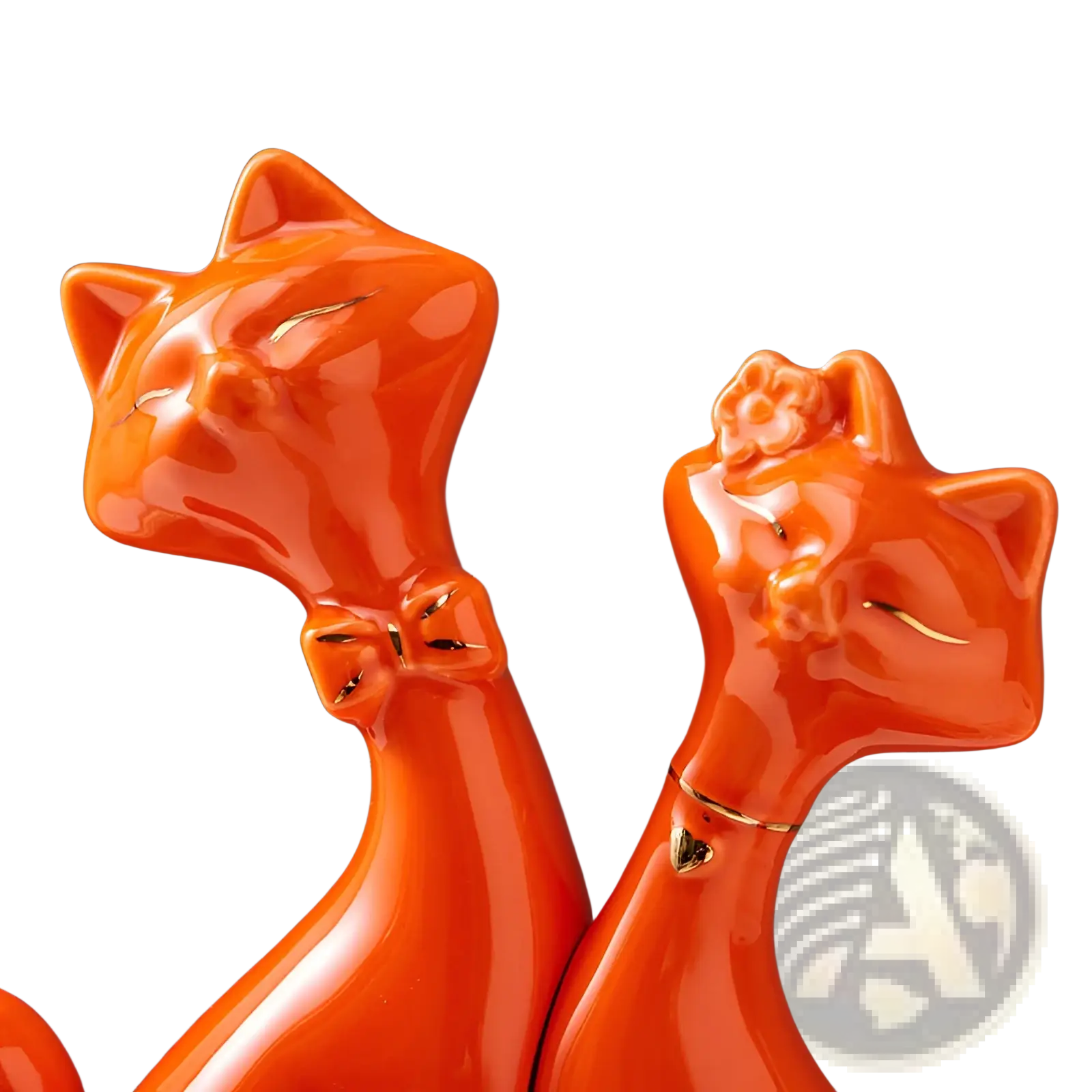 Vibrant orange ceramic cat figurines with glossy finish and gold accents for modern gold and white home decor
