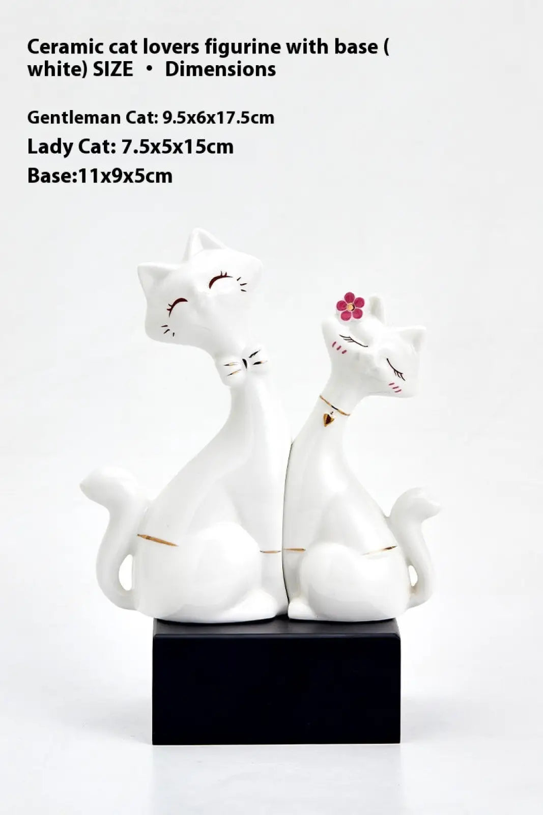 White ceramic cat figurines with gold accents and a pink flower modern gold and white home decor pieces