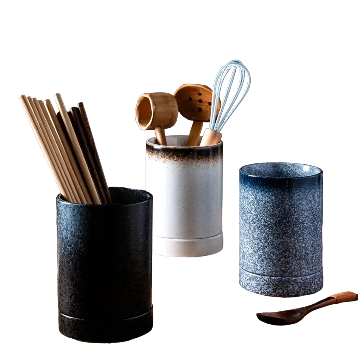Three ceramic chopstick holder storage racks with speckled glazes in black white-blue gradient and blue-gray tones