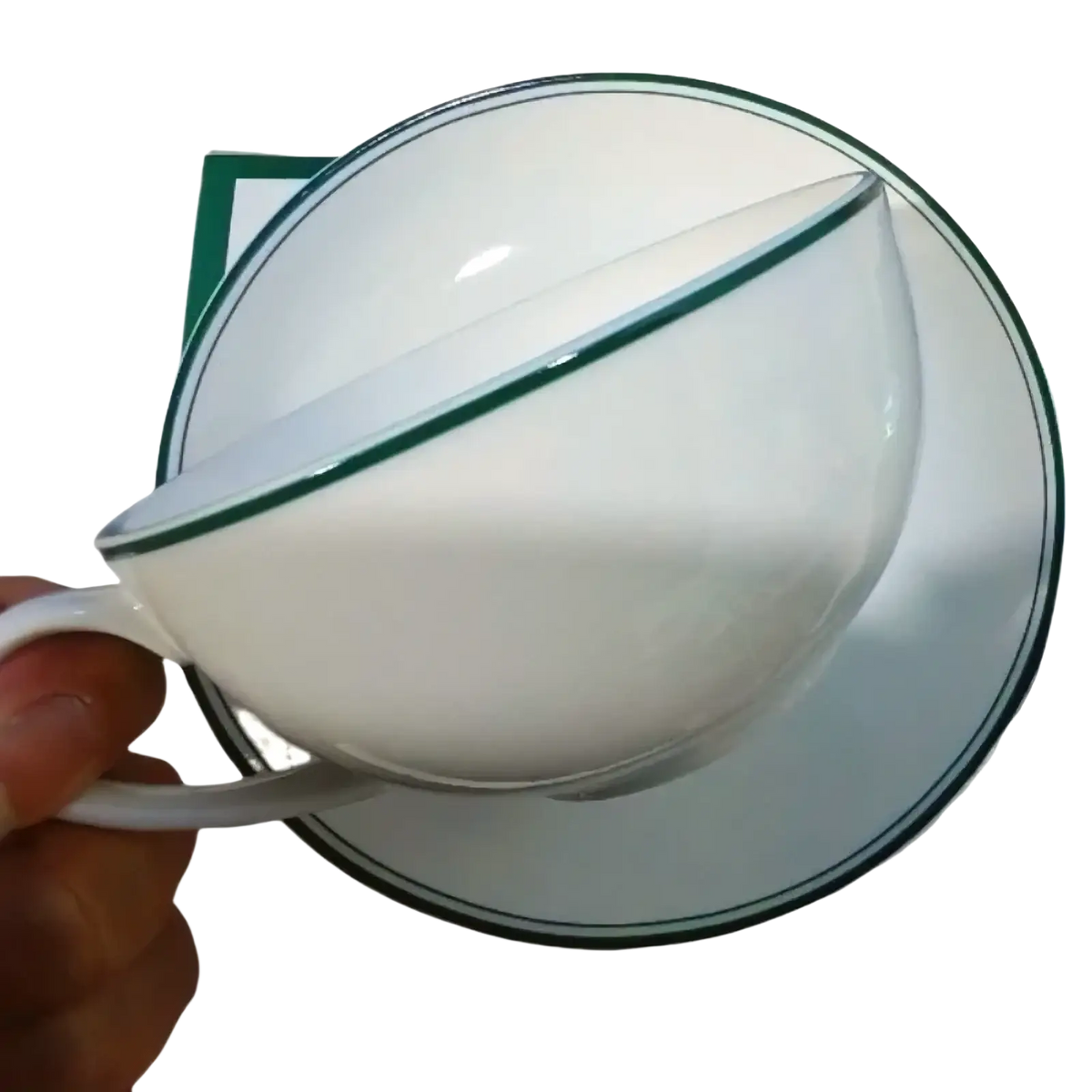 White ceramic coffee cup and saucer set with a delicate vintage green rim for elegant serving