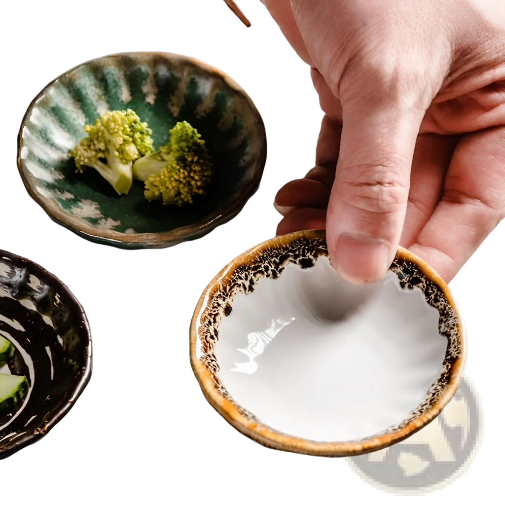 A hand holds a small white ceramic condiment bowl with a speckled brown rim and textured interior for snacks