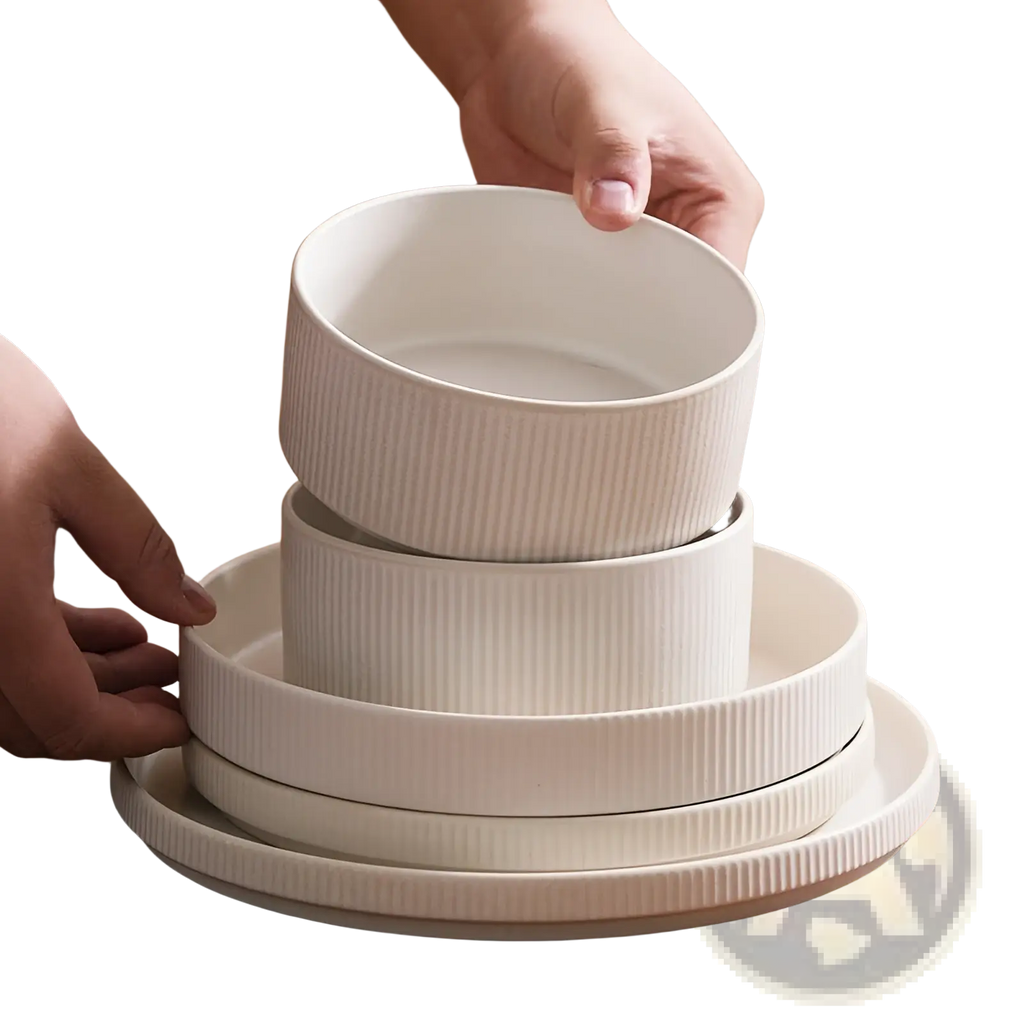 Stacked white ceramic bowls with vertical ribbed texture from a 16 piece vintage embossed dinnerware set