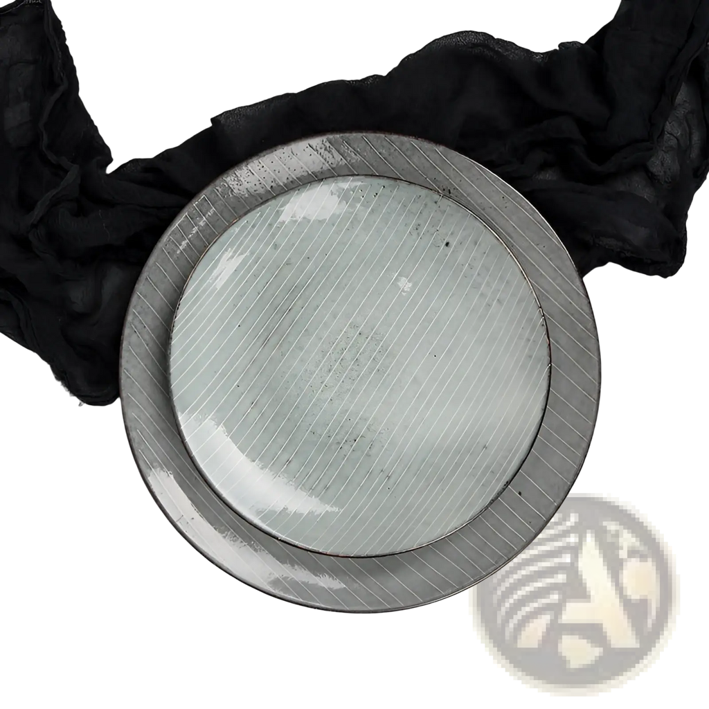 A pair of ceramic dinnerware plates with matte light green centers and silver-toned diagonally striped rims