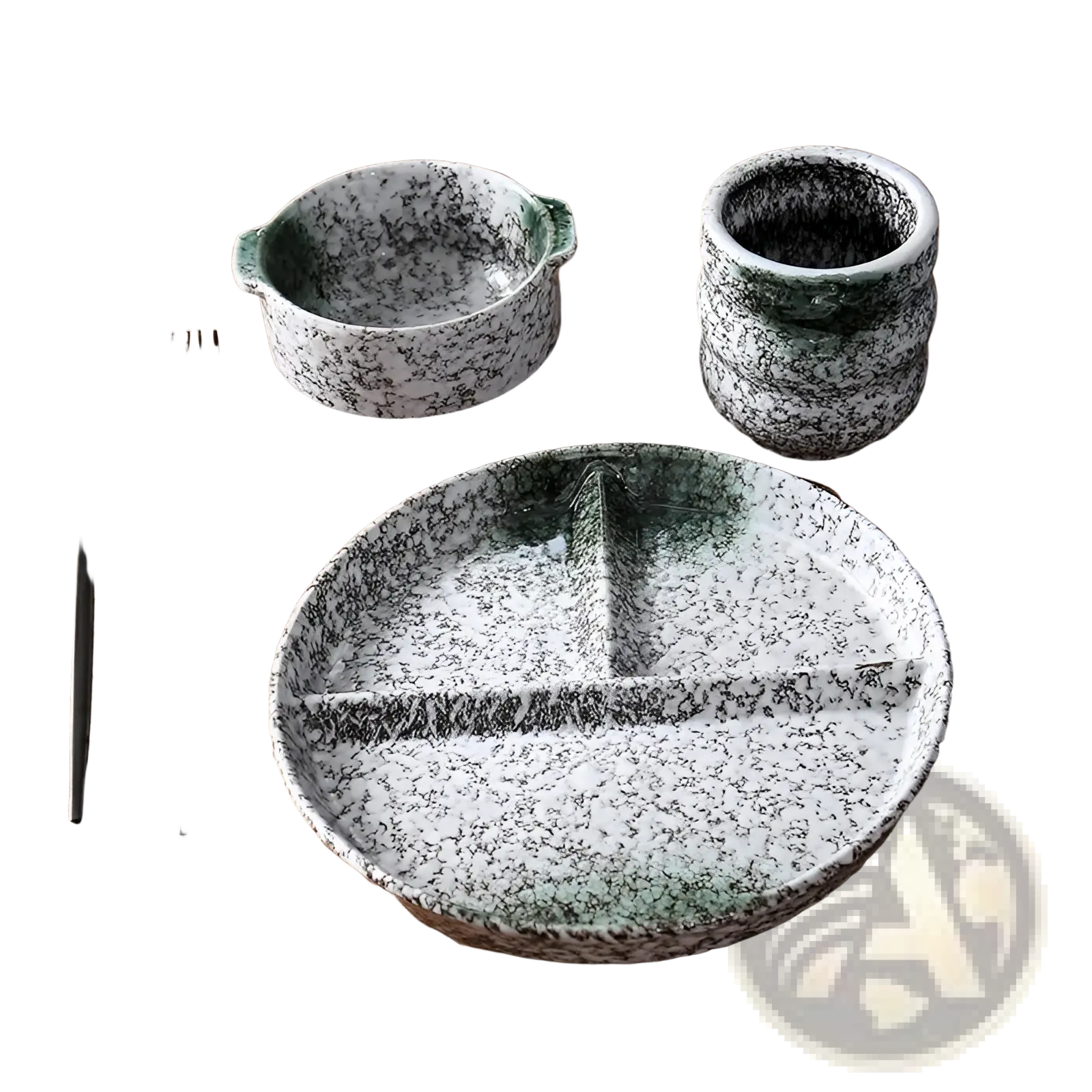Ceramic divided dinner plate set with speckled glaze featuring a white ceramic plate with black speckles and a green rim