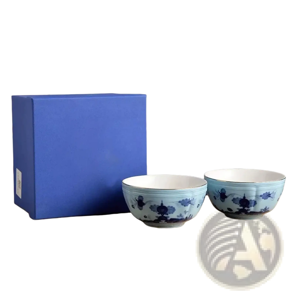 Two 4.5-inch blue and white porcelain floral bowls beside a matching royal blue gift box from ceramic tableware set