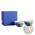 Two 4.5-inch blue and white porcelain floral bowls beside a matching royal blue gift box from ceramic tableware set