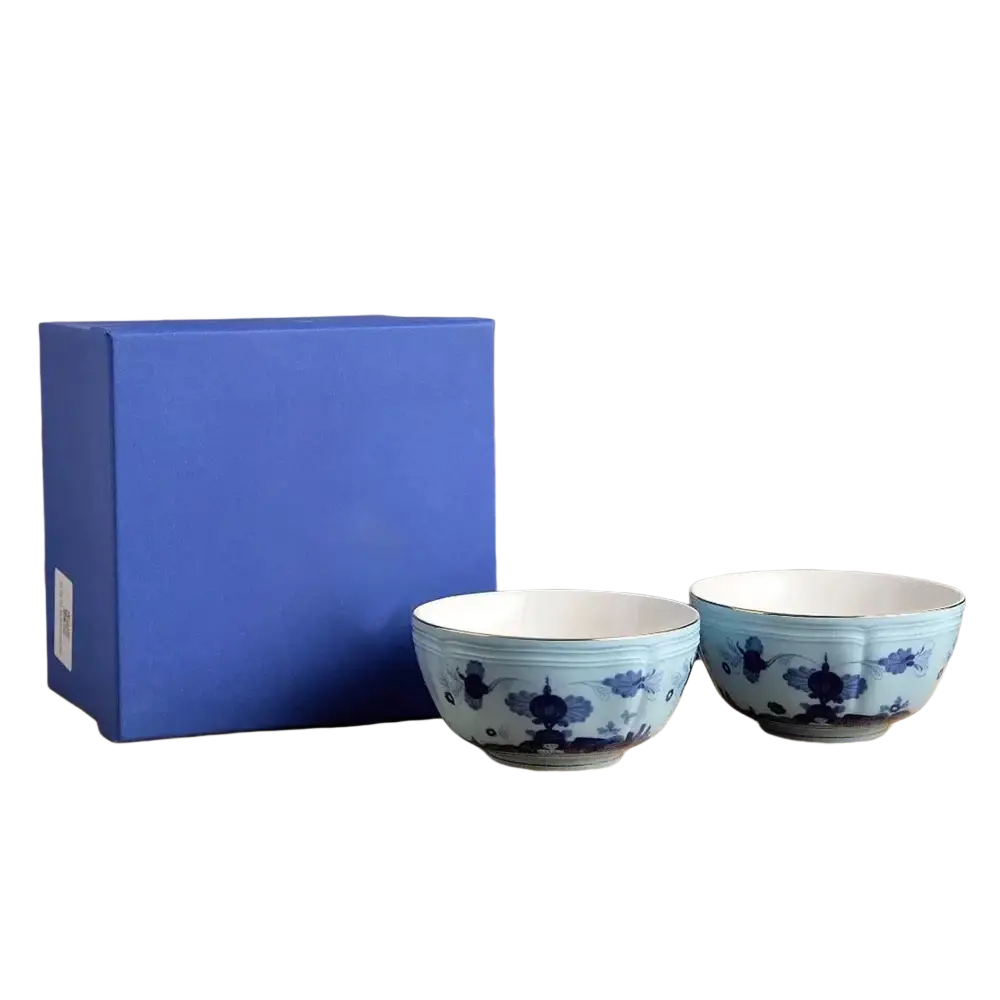 Two 4.5-inch blue and white porcelain floral bowls beside a matching royal blue gift box from ceramic tableware set