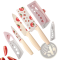 Set of four ceramic kitchen knives with tomato pattern blades and cream textured handles with heart sheaths
