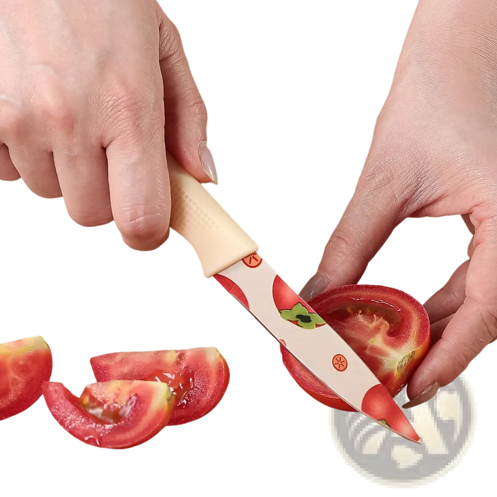 Beige-handled ceramic kitchen knife with white blade featuring red tomato and green leaf patterns for slicing