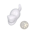 White ceramic cat-shaped hook with a smooth glossy finish used as a minimalist calligraphy brush rest