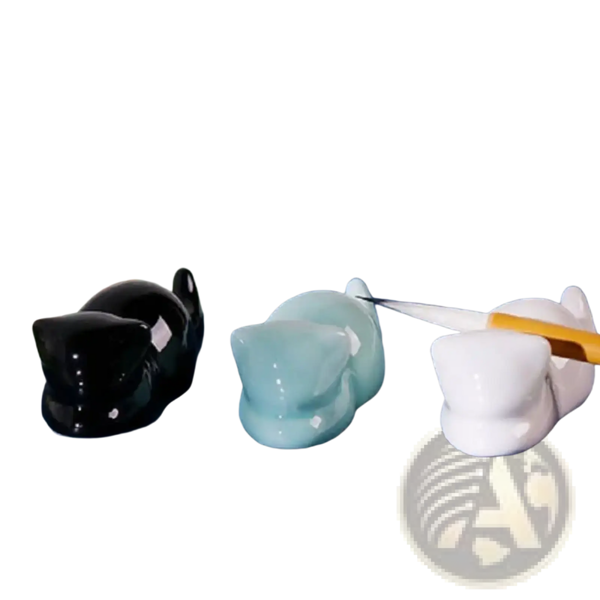 Three glossy ceramic cat-shaped pen holders in black light blue and white minimalist calligraphy brush rests