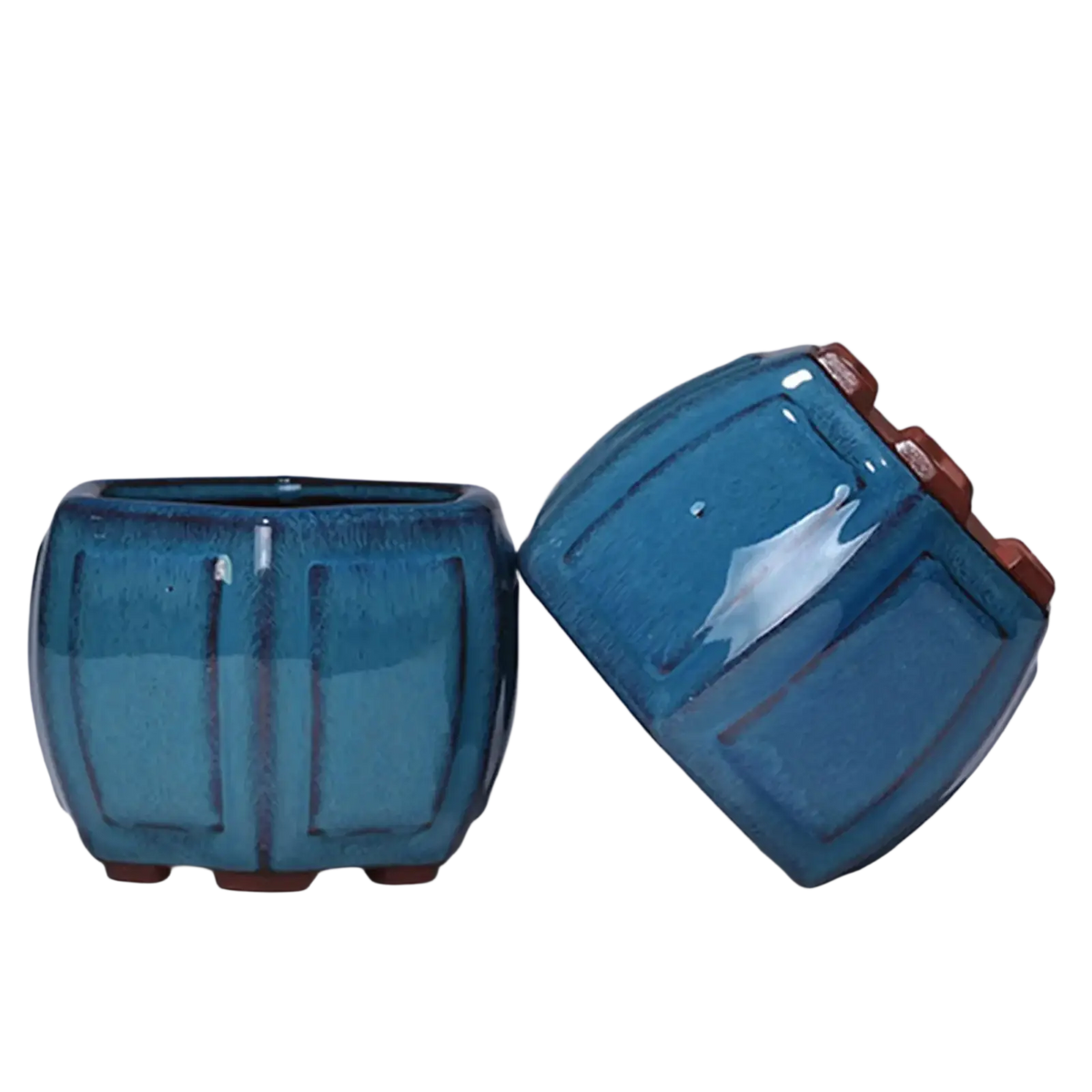Blue ribbed ceramic plant pots with glossy finish and earthy brown accents featuring drainage hole for plants