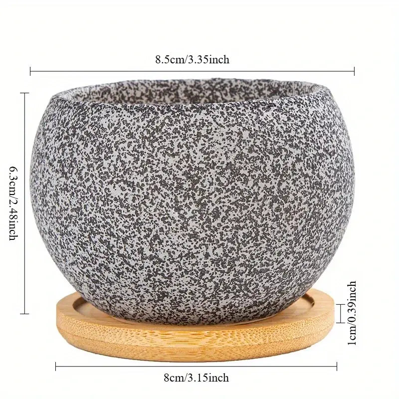 Gray speckled ceramic planter with matching bamboo saucer for succulents in ceramic planters with wooden saucer set