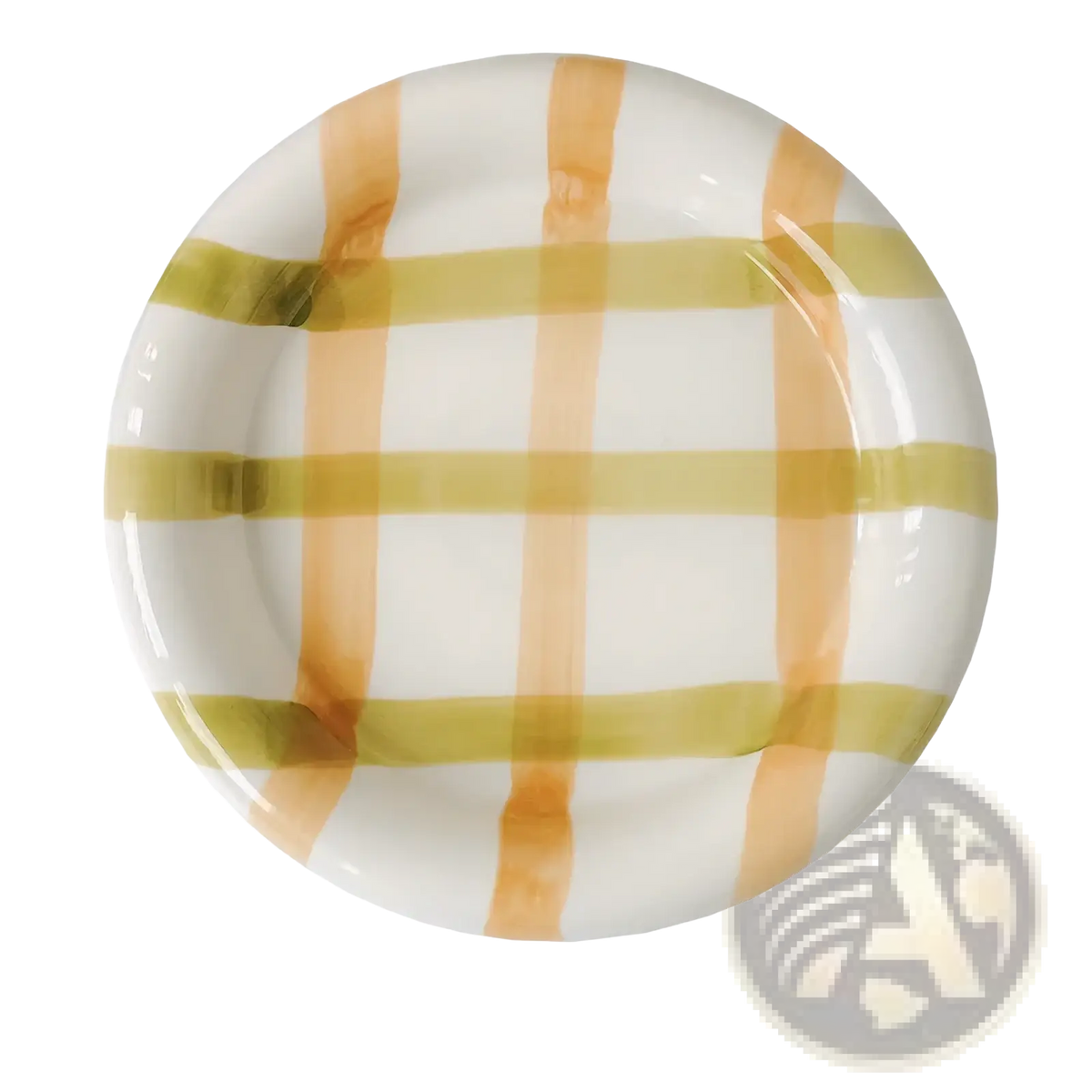 A round ceramic plate with a glossy white surface and peach and olive green stripes in a decorative tableware set