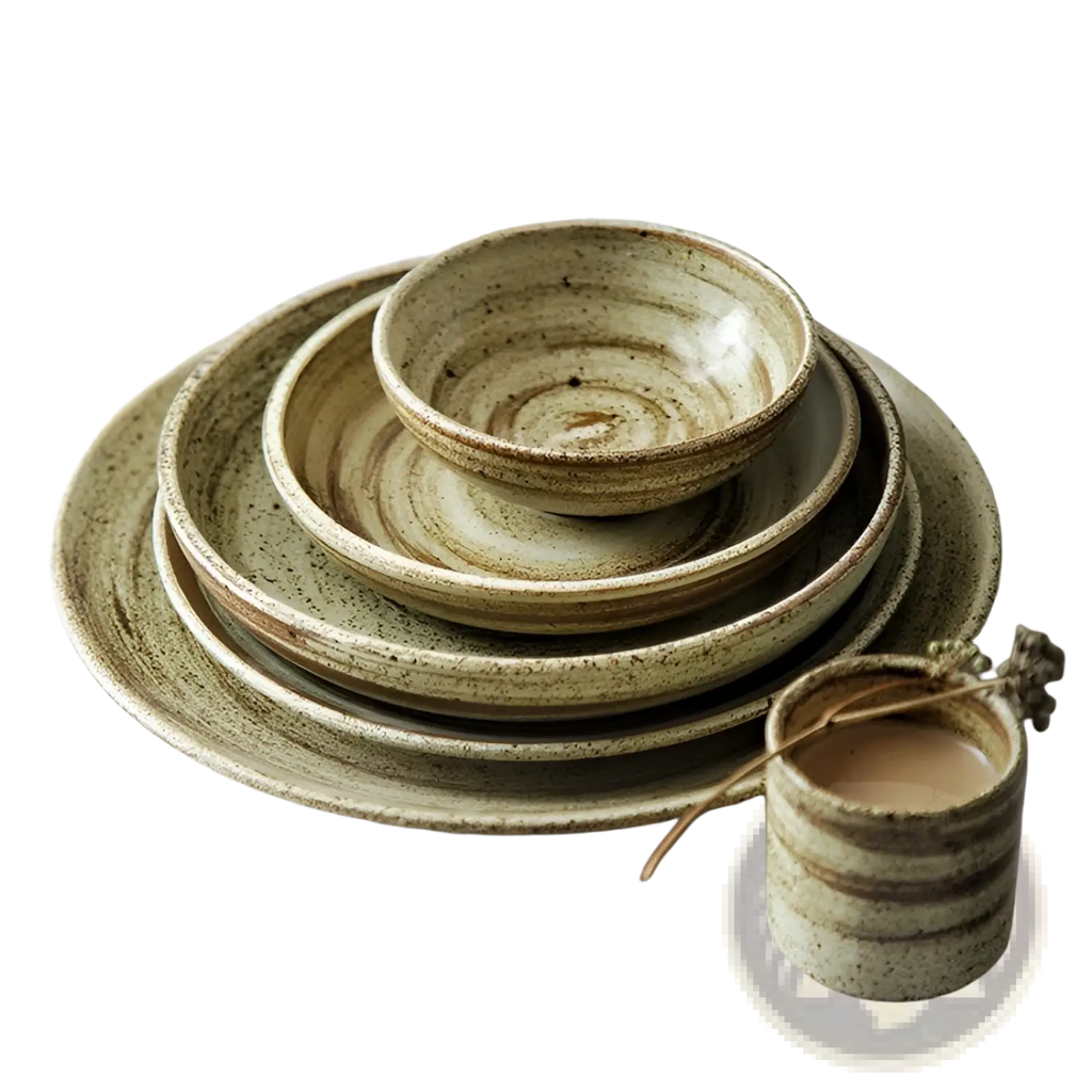 Ceramic rustic speckled stoneware tableware set with earthy green and beige glaze featuring concentric rings on plates and bowls
