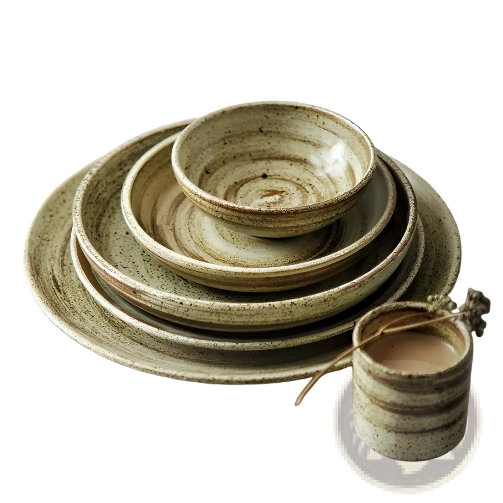 Ceramic rustic speckled stoneware tableware set with earthy green and beige glaze featuring concentric rings on plates and bowls